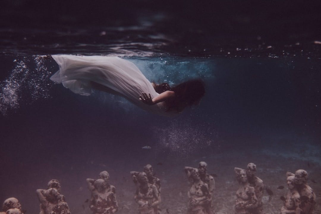 woman in white dress in water